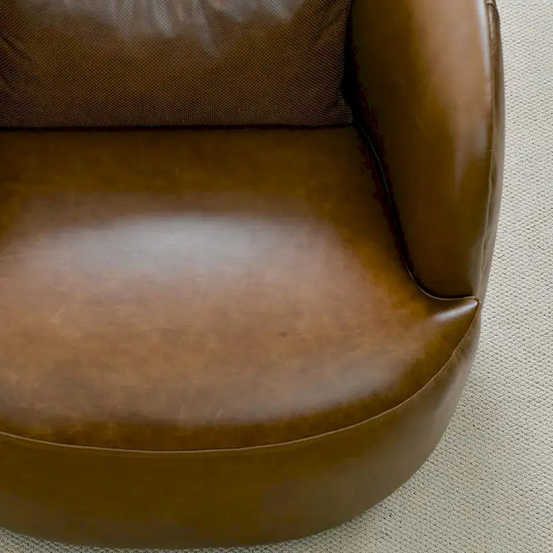 Sillón giratorio moderno de cuero genuino de grano superior con cojín
